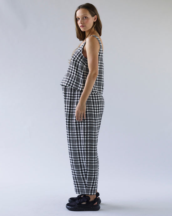 pregnant model wears mono check linen nora top