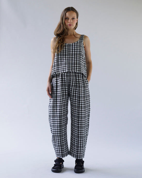 pregnant model wears mono check linen nora top