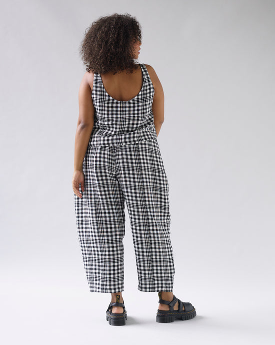 model wears mono check linen nora top