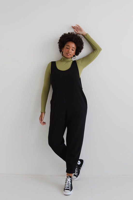 model wears black laura jumpsuit