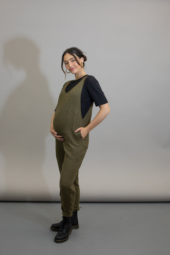 pregnant model wears khaki linen laura jumpsuit