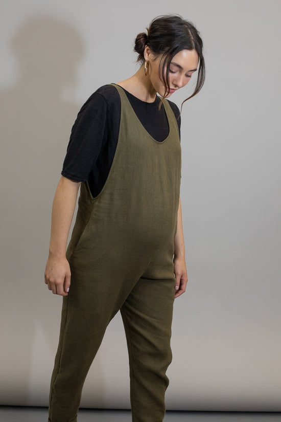 pregnant model wears khaki linen laura jumpsuit