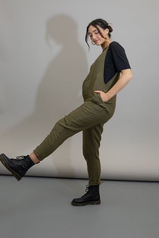 pregnant model wears khaki linen laura jumpsuit