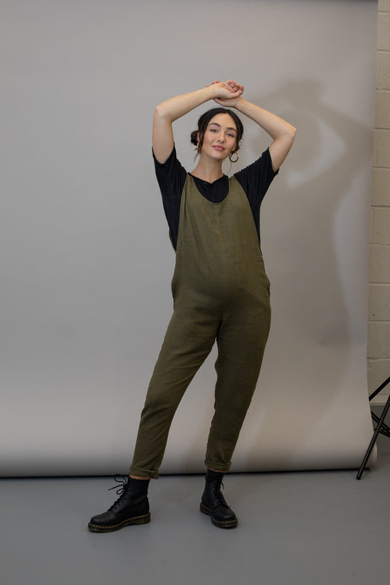 pregnant model wears khaki linen laura jumpsuit