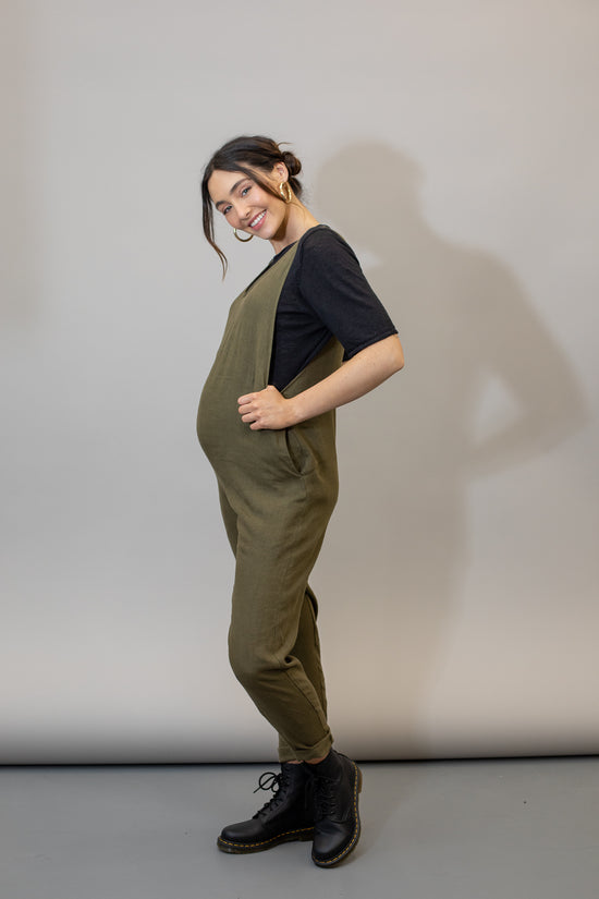 pregnant model wears khaki linen laura jumpsuit