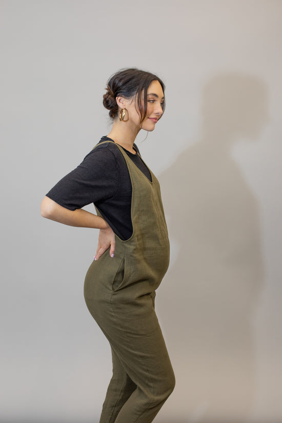 pregnant model wears khaki linen laura jumpsuit