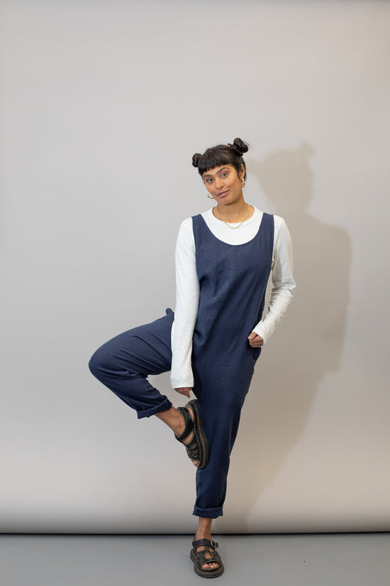 model wears navy linen laura jumpsuit