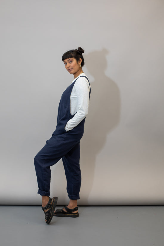 model wears navy linen laura jumpsuit