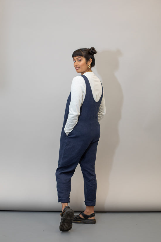 model wears navy linen laura jumpsuit