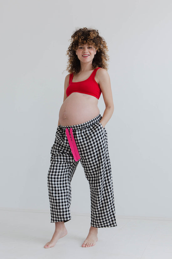 pregnant model wears black and white gingham ultimate pj linen trousers