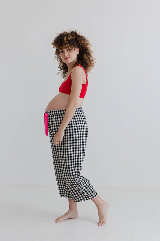 pregnant model wears black and white gingham ultimate pj linen trousers