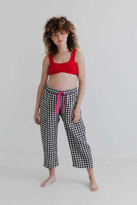 pregnant model wears black and white gingham ultimate pj linen trousers