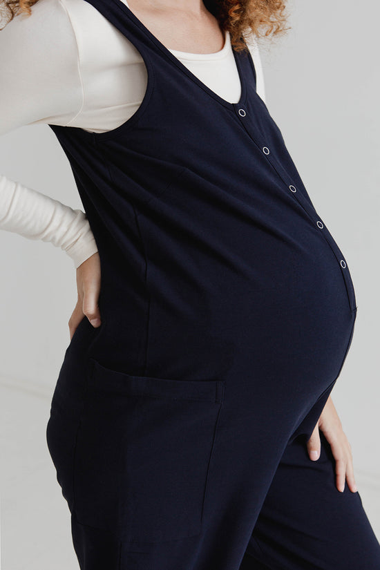 pregnant model wears might ight navy jersey poppy jumpsuit