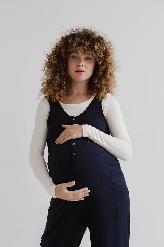 pregnant model wears might ight navy jersey poppy jumpsuit