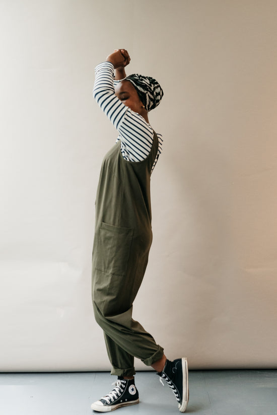 model wears olive jersey poppy jumpsuit