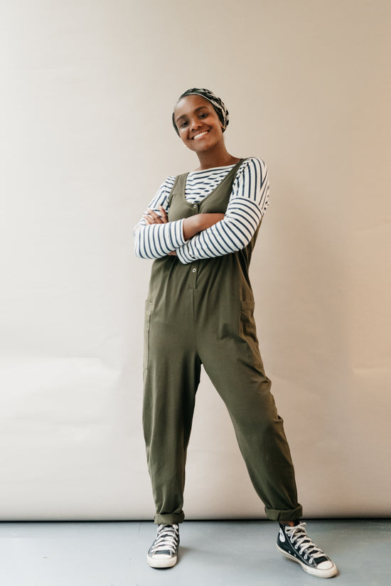 model wears olive jersey poppy jumpsuit