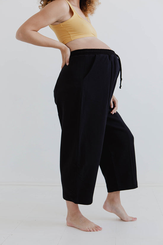 pregnant model wears black jersey jenny trousers