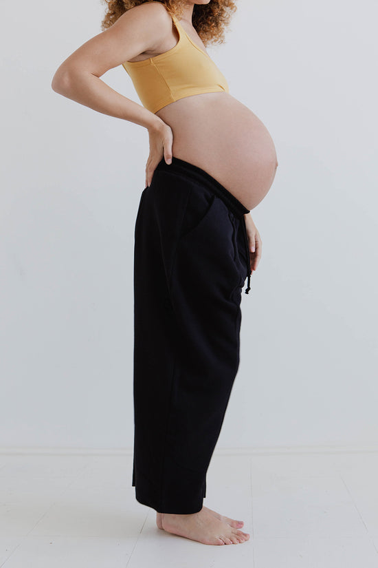 pregnant model wears black jersey jenny trousers