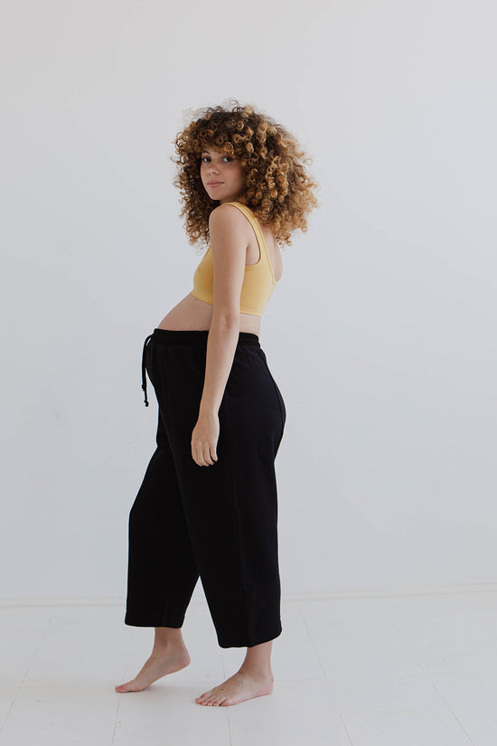 pregnant model wears black jersey jenny trousers