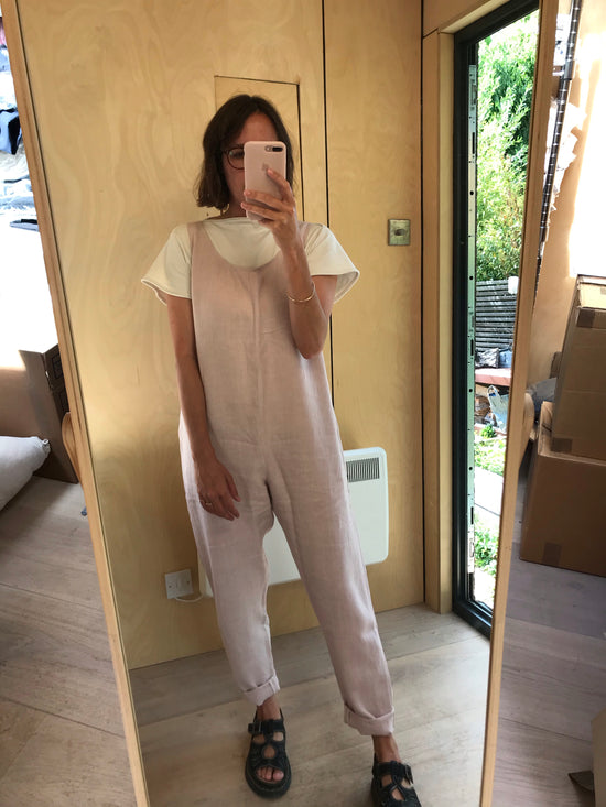 model wears linen rose laura jumpsuit